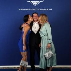KOHLER, WISCONSIN - SEPTEMBER 22: Viktor Hovland of Norway and team Europe poses with Angela Akins Garcia and Emma Lofgren during the Team Europe Gala Dinner prior to the 43rd Ryder Cup at The American Club on September 22, 2021 in Kohler, Wisconsin. (Photo by Warren Little/Getty Images)