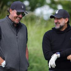 ST ALBANS, ENGLAND - JUNE 08: Phil Mickelson of the United States talks to His Excellency Yasir Al-Rumayyan during the Pro-Am ahead of the LIV Golf Invitational at The Centurion Club on June 08, 2022 in St Albans, England. (Photo by Charlie Crowhurst/LIV Golf/Getty Images)