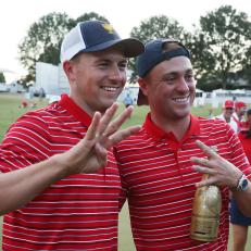 CHARLOTTE, NORTH CAROLINA - SEPTEMBER 25: (L-R) Jordan Spieth and Justin Thomas of the United States Team celebrate after defeating the International Team during Sunday singles matches on day four of the 2022 Presidents Cup at Quail Hollow Country Club on September 25, 2022 in Charlotte, North Carolina. (Photo by Rob Carr/Getty Images)