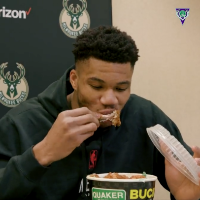 Giannis Antetokounmpo chowing down on wings during his postgame press conference is going to make you really want wings