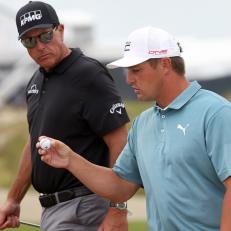 KIAWAH ISLAND, SOUTH CAROLINA - MAY 19: Phil Mickelson of the United States and Bryson DeChambeau of the United States walk off the tenth hole during a practice round prior to the 2021 PGA Championship at Kiawah Island Resort's Ocean Course on May 19, 2021 in Kiawah Island, South Carolina. (Photo by Jamie Squire/Getty Images)
