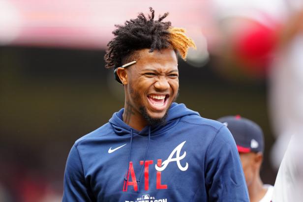 Ronald Acuña Jr. #13 of the Atlanta Braves smiles after winning