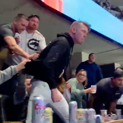 This pathetic 'hold me back' performance from an Avalanche fan has no place in an NHL arena