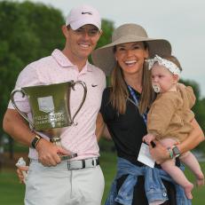 CHARLOTTE, NC - MAY 09: Rory McIlroy of Northern Ireland holds the trophy with his wife Erica and baby daughter Poppy on the 18th green after the final round of the Wells Fargo Championship at Quail Hollow Club on May 9, 2021 in Charlotte, North Carolina. (Photo by Ben Jared/PGA TOUR via Getty Images)