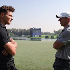 DUBAI, UNITED ARAB EMIRATES - JANUARY 26: Rory McIlroy of Northern Ireland talks with Lando Norris after the pro-am prior to the Slync.io Dubai Desert Classic at Emirates Golf Club on January 26, 2022 in Dubai, United Arab Emirates. (Photo by Luke Walker/Getty Images)
