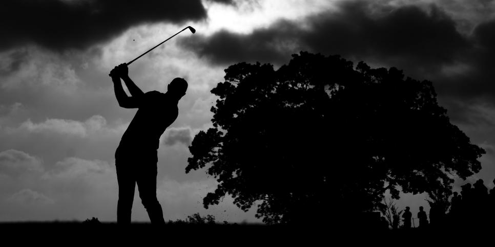 TULSA, OKLAHOMA - MAY 20: (EDITOR'S NOTE:This image has been converted to black and white.) Dustin Johnson of the United States plays his shot from the 11th tee during the second round of the 2022 PGA Championship at Southern Hills Country Club on May 20, 2022 in Tulsa, Oklahoma. (Photo by Christian Petersen/Getty Images)