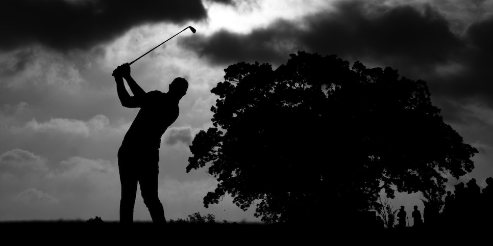 TULSA, OKLAHOMA - MAY 20: (EDITOR'S NOTE:This image has been converted to black and white.) Dustin Johnson of the United States plays his shot from the 11th tee during the second round of the 2022 PGA Championship at Southern Hills Country Club on May 20, 2022 in Tulsa, Oklahoma. (Photo by Christian Petersen/Getty Images)