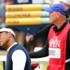 ST ANDREWS, SCOTLAND - JULY 14: Tiger Woods of the United States stretches on the first tee during Day One of The 150th Open at St Andrews Old Course on July 14, 2022 in St Andrews, Scotland. (Photo by Kevin C. Cox/Getty Images)