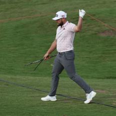 ABU DHABI, UNITED ARAB EMIRATES - JANUARY 22: Tyrrell Hatton of England carries his club after the shaft snapped on the eighteenth hole during the Third Round of the Abu Dhabi HSBC Championship at Yas Links Golf Course on January 22, 2022 in Abu Dhabi, United Arab Emirates. (Photo by Andrew Redington/Getty Images)