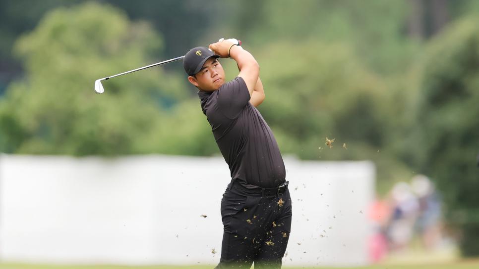 CHARLOTTE, NORTH CAROLINA - SEPTEMBER 25: Tom Kim of South Korea and the International Team plays a second shot on the second hole during Sunday singles matches on day four of the 2022 Presidents Cup at Quail Hollow Country Club on September 25, 2022 in Charlotte, North Carolina. (Photo by Stacy Revere/Getty Images)