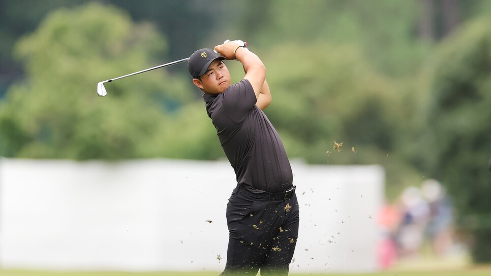 CHARLOTTE, NORTH CAROLINA - SEPTEMBER 25: Tom Kim of South Korea and the International Team plays a second shot on the second hole during Sunday singles matches on day four of the 2022 Presidents Cup at Quail Hollow Country Club on September 25, 2022 in Charlotte, North Carolina. (Photo by Stacy Revere/Getty Images)