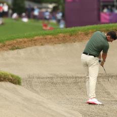 KAWAGOE, JAPAN - JULY 30: Rory McIlroy of Team Ireland plays a shot from a fairway bunker on the ninth hole during the second round of the Men's Individual Stroke Play on day seven of the Tokyo 2020 Olympic Games at Kasumigaseki Country Club on July 30, 2021 in Kawagoe, Saitama, Japan. (Photo by Mike Ehrmann/Getty Images)