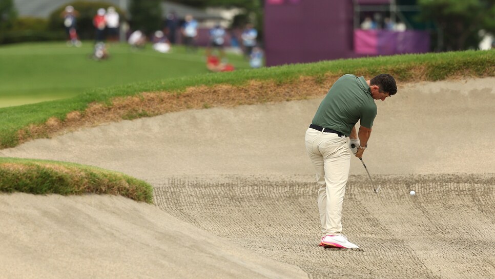 KAWAGOE, JAPAN - JULY 30: Rory McIlroy of Team Ireland plays a shot from a fairway bunker on the ninth hole during the second round of the Men's Individual Stroke Play on day seven of the Tokyo 2020 Olympic Games at Kasumigaseki Country Club on July 30, 2021 in Kawagoe, Saitama, Japan. (Photo by Mike Ehrmann/Getty Images)