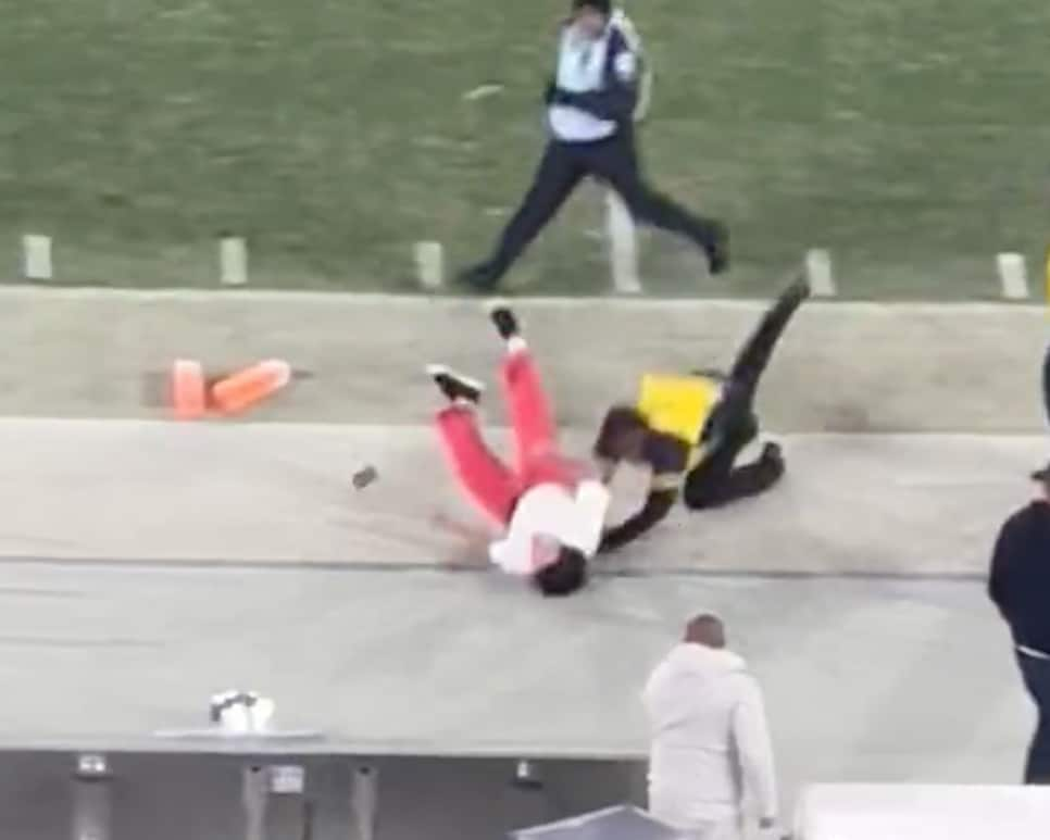 Streaker darts on field of NFL game, somehow grabs a football then security  causes fumble