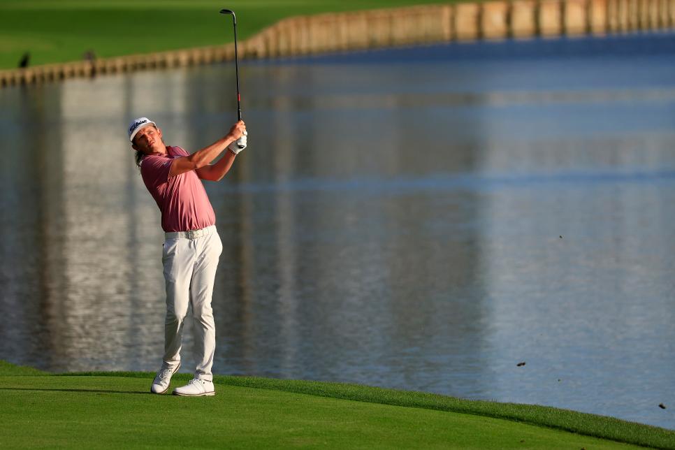 PONTE VEDRA BEACH, FLORIDA - MARCH 14: Cameron Smith of Australia plays an approach shot on the 18th fairway during the final round of THE PLAYERS Championship on the Stadium Course at TPC Sawgrass on March 14, 2022 in Ponte Vedra Beach, Florida. (Photo by Mike Ehrmann/Getty Images)