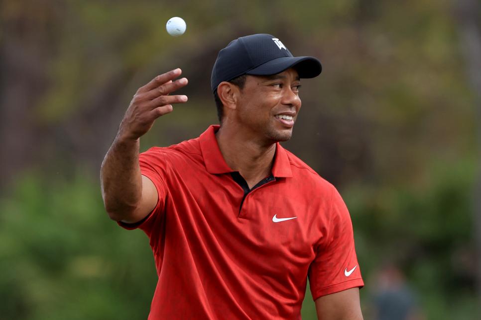 ORLANDO, FLORIDA - DECEMBER 19: Tiger Woods tosses a ball on the second hole during the final round of the PNC Championship at the Ritz Carlton Golf Club Grande Lakes   on December 19, 2021 in Orlando, Florida. (Photo by Sam Greenwood/Getty Images)