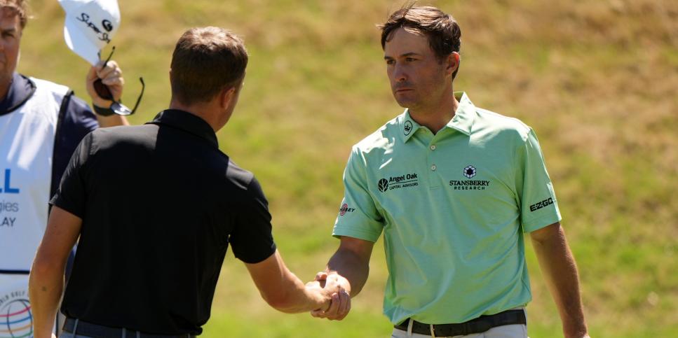 AUSTIN, TEXAS - MARCH 25: Kevin Kisner of the United States shakes hands with Justin Thomas of the United States after winning his match during the second round of the World Golf Championships-Dell Technologies Match Play at Austin Country Club on March 25, 2021 in Austin, Texas. (Photo by Darren Carroll/Getty Images)