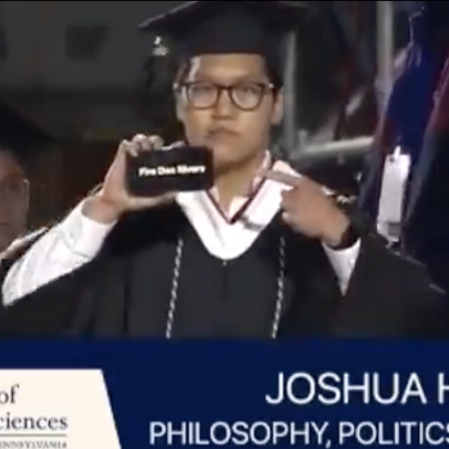Penn student holds up “Fire Doc Rivers” sign during graduation walk, might be the most Sixers Sixers fan ever