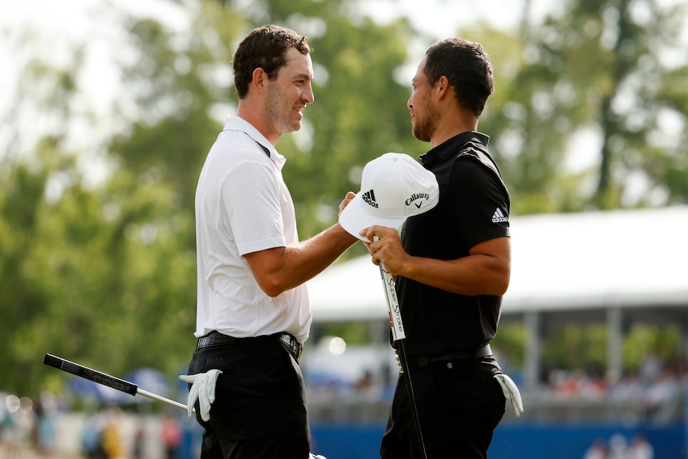 AVONDALE, LOUISIANA - APRIL 24: Xander Schauffele and Patrick Cantlay react after putting in to win on the 18th green during the final round of the Zurich Classic of New Orleans at TPC Louisiana on April 24, 2022 in Avondale, Louisiana. (Photo by Chris Graythen/Getty Images)