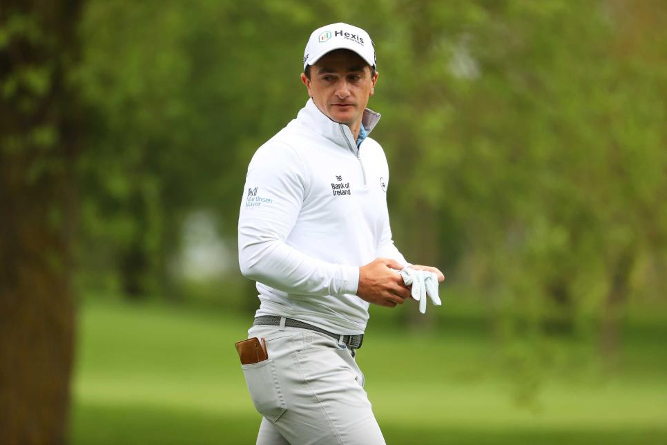 SUTTON COLDFIELD, ENGLAND - MAY 14: Paul Dunne of Ireland looks on as he walks on the fourth hole during the Third Round of The Betfred British Masters hosted by Danny Willett at The Belfry on May 14, 2021 in Sutton Coldfield, England. Sporting stadiums around the UK remain under strict restrictions due to the Coronavirus Pandemic as Government social distancing laws prohibit fans inside venues resulting in games being played behind closed doors. (Photo by Andrew Redington/Getty Images)