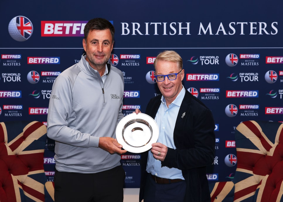 SUTTON COLDFIELD, ENGLAND - MAY 04: Richard Bland of England is presented with a Silver Salver to mark their 500th start by Keith Pelley, CEO of the DP World Tour during the Pro-Am ahead of the Betfred British Masters hosted by Danny Willett at The Belfry on May 04, 2022 in Sutton Coldfield, England. (Photo by Richard Heathcote/Getty Images)