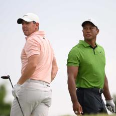 TULSA, OKLAHOMA - MAY 20: Rory McIlroy of Northern Ireland and Tiger Woods of the United States watch a tee shot on the 10th tee during the second round of the 2022 PGA Championship at Southern Hills Country Club on May 20, 2022 in Tulsa, Oklahoma. (Photo by Ross Kinnaird/Getty Images)