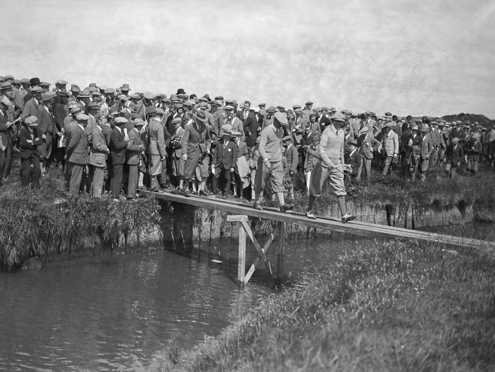 Scottish golfer MacDonald Smith (1892 - 1949) crosses the burn at Prestwick Golf Club in Scotland, during the Open Golf Championship , 26th June 1925. (Photo by Kirby/Topical Press Agency/Hulton Archive/Getty Images)