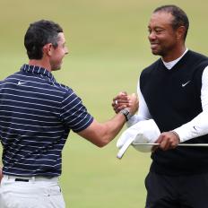 ST ANDREWS, SCOTLAND - JULY 11: Rory McIlroy of Northern Ireland and Tiger Woods of the United States embrace during the Celebration of Champions prior to The 150th Open at St Andrews Old Course on July 11, 2022 in St Andrews, Scotland. (Photo by Charlie Crowhurst/R&A/R&A via Getty Images)