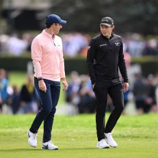 VIRGINIA WATER, ENGLAND - SEPTEMBER 10: Rory McIlroy of Northern Ireland talks with Matthew Fitzpatrick of England during Round Two on Day Three of the BMW PGA Championship at Wentworth Golf Club on September 10, 2022 in Virginia Water, England. (Photo by Ross Kinnaird/Getty Images)