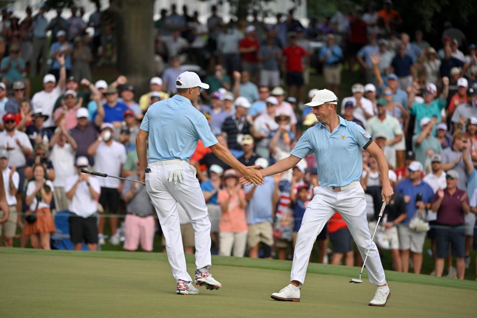 CHARLOTTE, NORTH CAROLINA - SEPTEMBER 22: U.S. Team members Jordan Spieth and Justin Thomas celebrate Justins putt on the 15th hole during the first round of Presidents Cup at Quail Hollow September 22, 2022, in Charlotte, North Carolina. (Photo by Ben Jared/PGA TOUR via Getty Images)