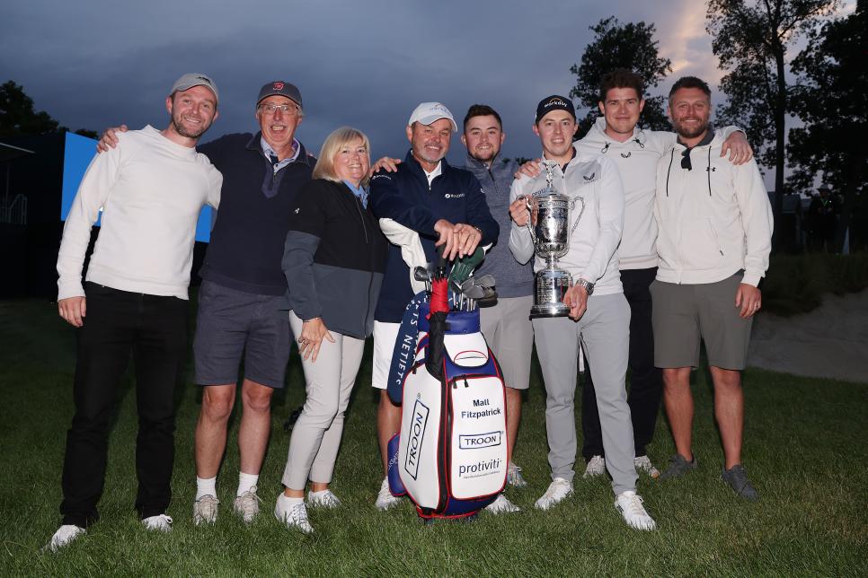 BROOKLINE, MASSACHUSETTS - JUNE 19: Matt Fitzpatrick (3rd R) of England poses with the U.S. Open Championship trophy alongside father Russell (2nd L), brother Alex (4th R), mother Susan (3rd L), caddie Billy Foster (4th L) and team after winning during the final round of the 122nd U.S. Open Championship at The Country Club on June 19, 2022 in Brookline, Massachusetts. (Photo by Warren Little/Getty Images)