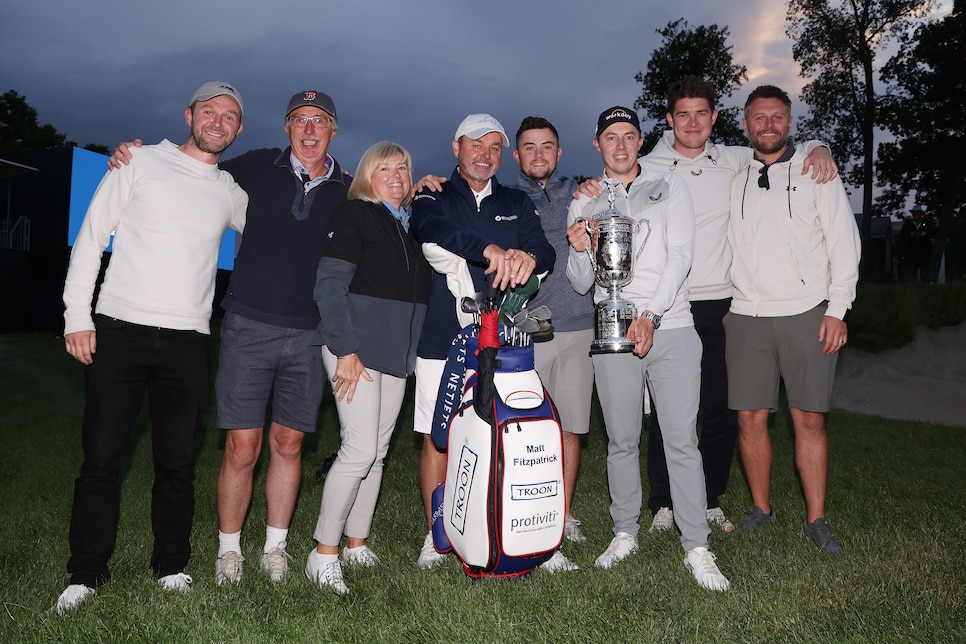 BROOKLINE, MASSACHUSETTS - JUNE 19: Matt Fitzpatrick (3rd R) of England poses with the U.S. Open Championship trophy alongside father Russell (2nd L), brother Alex (4th R), mother Susan (3rd L), caddie Billy Foster (4th L) and team after winning during the final round of the 122nd U.S. Open Championship at The Country Club on June 19, 2022 in Brookline, Massachusetts. (Photo by Warren Little/Getty Images)