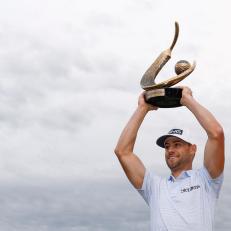 PALM HARBOR, FLORIDA - MARCH 19: Taylor Moore of the United States celebrates with the trophy after winning during the final round of the Valspar Championship at Innisbrook Resort and Golf Club on March 19, 2023 in Palm Harbor, Florida. (Photo by Douglas P. DeFelice/Getty Images)