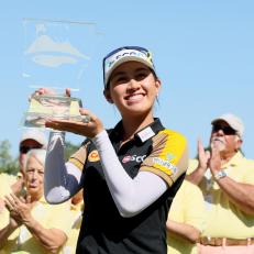 ROGERS, ARKANSAS - SEPTEMBER 25: Atthaya Thitikul of Thailand holds the winner's trophy after winning the Walmart NW Arkansas Championship Presented by P&G at Pinnacle Country Club on September 25, 2022 in Rogers, Arkansas. (Photo by Andy Lyons/Getty Images)