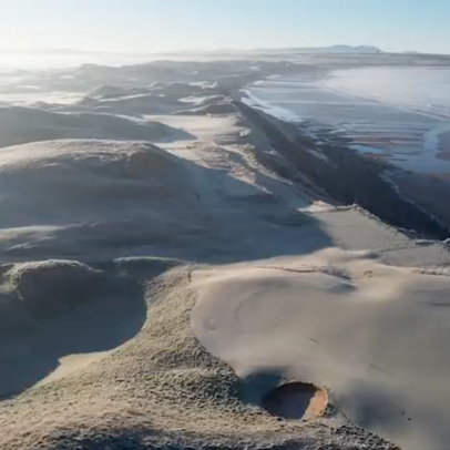 This drone flyover of Ballybunion completely covered in frost is your daily dose of zen