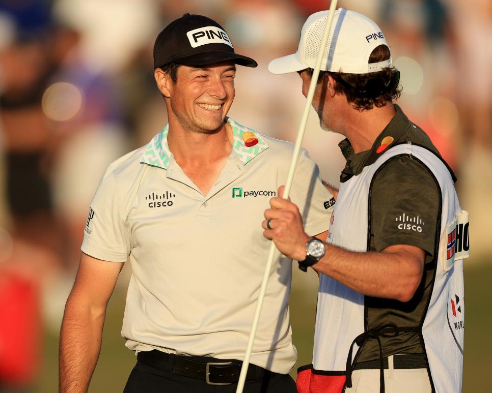 NASSAU, BAHAMAS - DECEMBER 04: Viktor Hovland of Norway celebrates with his caddie Shay Knight after he had holed the winning putt on the 18th hole during the final round of the 2022 Hero World Challenge at Albany Golf Course on December 04, 2022 in Nassau, Bahamas. (Photo by David Cannon/Getty Images)