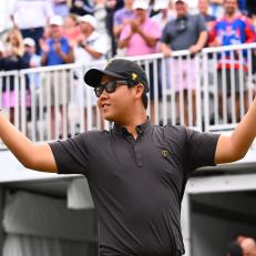 CHARLOTTE, NORTH CAROLINA - SEPTEMBER 25: International Team Member Tom Kim of South Korea asks the crowd for more noise as he arrives on the first tee during the final round Sunday singles matches of Presidents Cup at Quail Hollow September 25, 2022, in Charlotte, North Carolina. (Photo by Chris Condon/PGA TOUR via Getty Images)