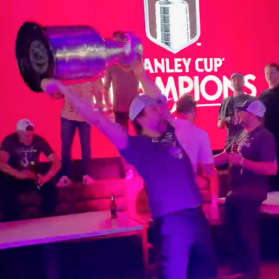 Colorado Avalanche defenseman Kurtis MacDermid getting folded by the Stanley Cup is today’s lesson in drunk physics
