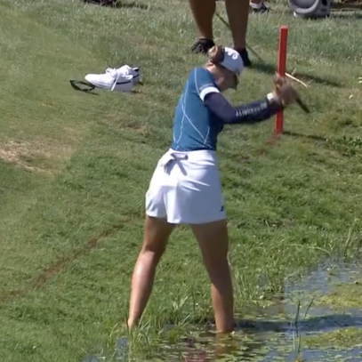 Nelly Korda went shoes off for this par save from a hazard at the Amundi Evian Championship