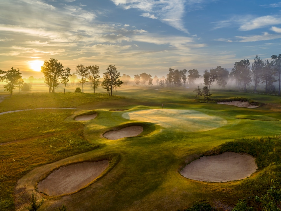 Sunrise on a misty and mystical morning at The Loop at Forest Dunes.  This view is looking back over the 12th green on the Black Course which also serves at the 6th green of the Red Course.  A wonderful reversible golf course designed by tom doak.