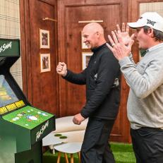 PACIFIC PALISADES, CA - FEBRUARY 15:  Joel Dahmen reacts as his caddie Geno Bonnalie defeats him in Golden Tee in the Netflix Full Swing Clubhouse during practice for the Genesis Invitational at Riviera Country Club on February 15, 2023 in Pacific Palisades, California. (Photo by Keyur Khamar/PGA TOUR via Getty Images)
