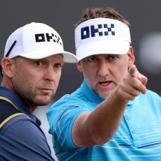 DUBAI, UNITED ARAB EMIRATES - JANUARY 27: Ian Poulter of England speaks with their Caddie on the 9th green during Day Two of the Hero Dubai Desert Classic at Emirates Golf Club on January 27, 2023 in Dubai, United Arab Emirates. (Photo by Warren Little/Getty Images)