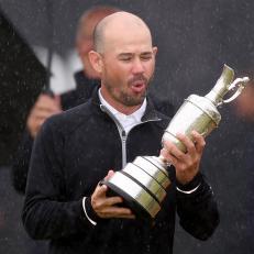 HOYLAKE, ENGLAND - JULY 23: Brian Harman of the United States celebrates after being presented with the Claret Jug on the 18th green on Day Four of The 151st Open at Royal Liverpool Golf Club on July 23, 2023 in Hoylake, England. (Photo by Gregory Shamus/Getty Images)