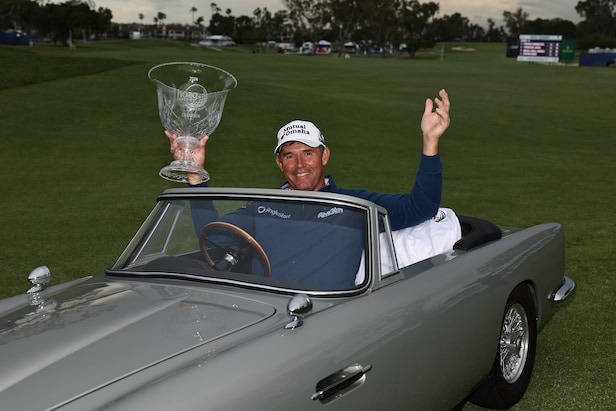 padraig-harrington-celebrates-victory-with-mini-aston-martin-joyride-and-perfect-dad-joke
