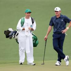 AUGUSTA, GEORGIA - APRIL 11: Nick Dunlap of the United States and his caddie, Hunter Hamrick, look on from the second green during the first round of the 2024 Masters Tournament at Augusta National Golf Club on April 11, 2024 in Augusta, Georgia.  (Photo by Jamie Squire/Getty Images)