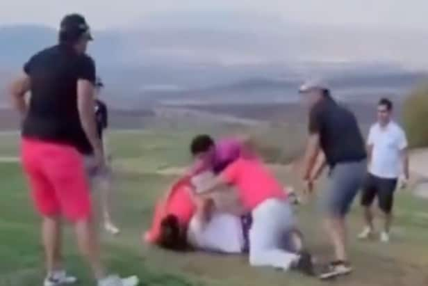 chaotic-golf-fight-ends-in-dog-pile,-broken-equipment-and-a-golf-club-being used-as-a weapon