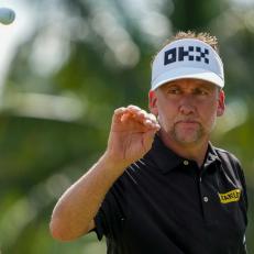 DORAL, FL - OCTOBER 28: Ian Poulter of Majesticks GC catches a ball from his caddie after putting on the seventh green during the quarterfinals of the LIV Golf Invitational - Miami at Trump National Doral Miami on October 28, 2022 in Doral, Florida. (Photo by Eric Espada/Getty Images)