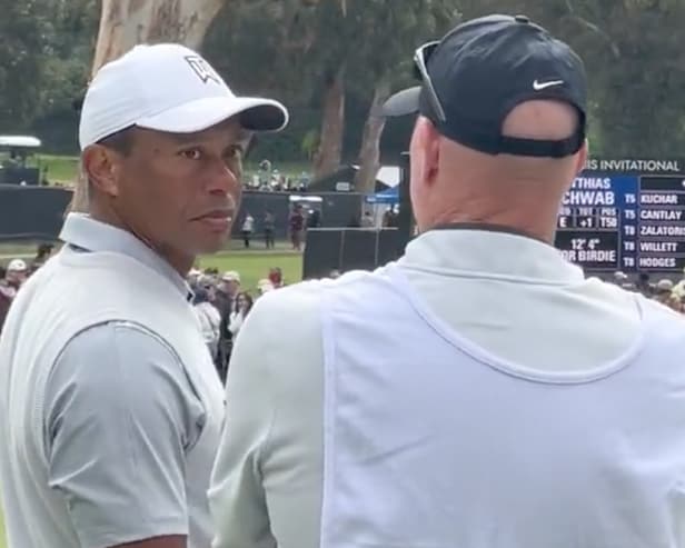 adorable-clip-shows-caddie-joe-lacava-notifying-tiger-woods-of-young-fan’s-‘bucket-list’-poster