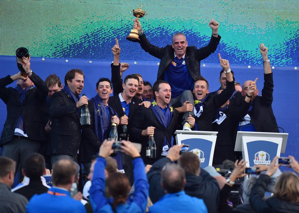 Captain of Team Europe Paul McGinley of Ireland  as he holds the trophy after his team retained the Ryder Cup on the final day of the Ryder Cup golf tournament at the Gleneagles Hotel in Gleneagles, Scotland, on September 28, 2014. Jamie Donaldson grabbed the crucial point Paul McGinley's side needed for the win when he defeated Keegan Bradley 4 and 3 in the 10th of the closing 12 singles. AFP PHOTO/BEN STANSALL        (Photo credit should read BEN STANSALL/AFP via Getty Images)