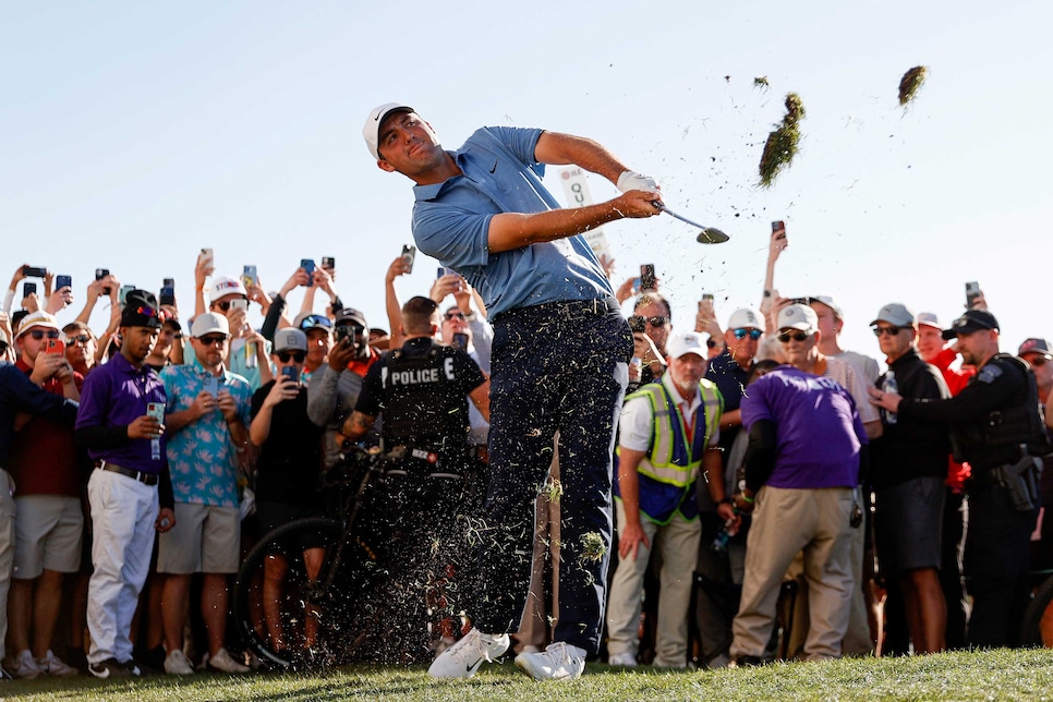 SCOTTSDALE, ARIZONA - FEBRUARY 12: Scottie Scheffler of the United States plays an approach shot on the 18th hole during the final round of the WM Phoenix Open at TPC Scottsdale on February 12, 2023 in Scottsdale, Arizona. (Photo by Steph Chambers/Getty Images)